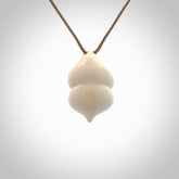 Hand carved mammoth tusk goddess pendant. Hand carved Mammoth Tusk jewellery for sale online by NZ Pacific. Delivered with a fine adjustable cord and packaged in a woven kete pouch.